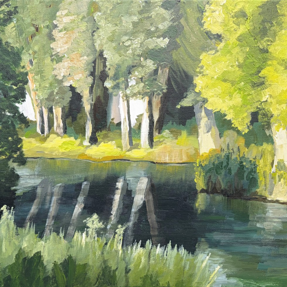 Impressionistic landscape painting of a calm waterway bordered by trees. Sunlight illuminates pale tree trunks and bright green foliage on the opposite bank, while their reflections stretch across the dark water.