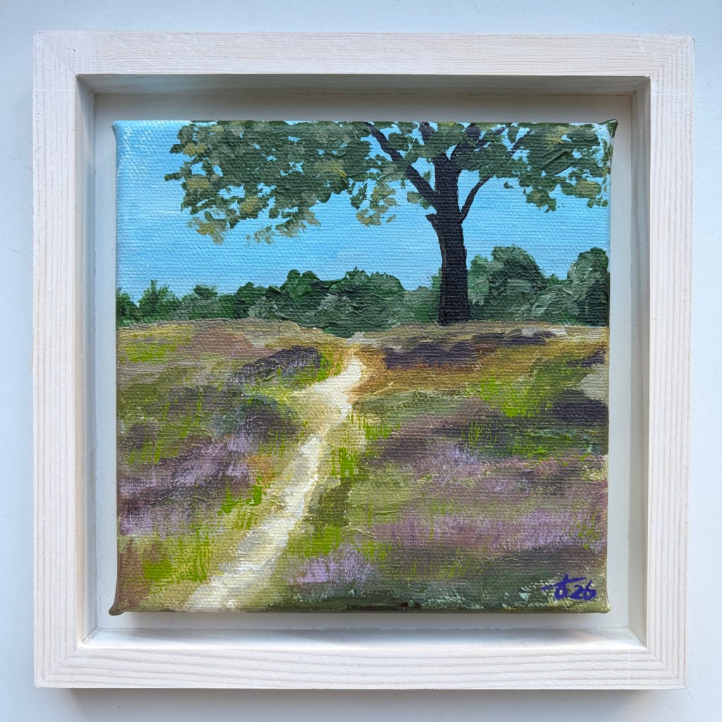 Miniature acrylic painting by artist Liane Kusters of a sandy path winding through purple and green heathland towards a large tree, in a white wooden floating frame.